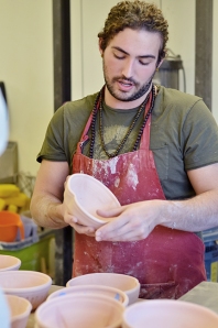 Ceramics Club President Galen Graham spearheads the bowl-making process. Photo by Matt Carlin
